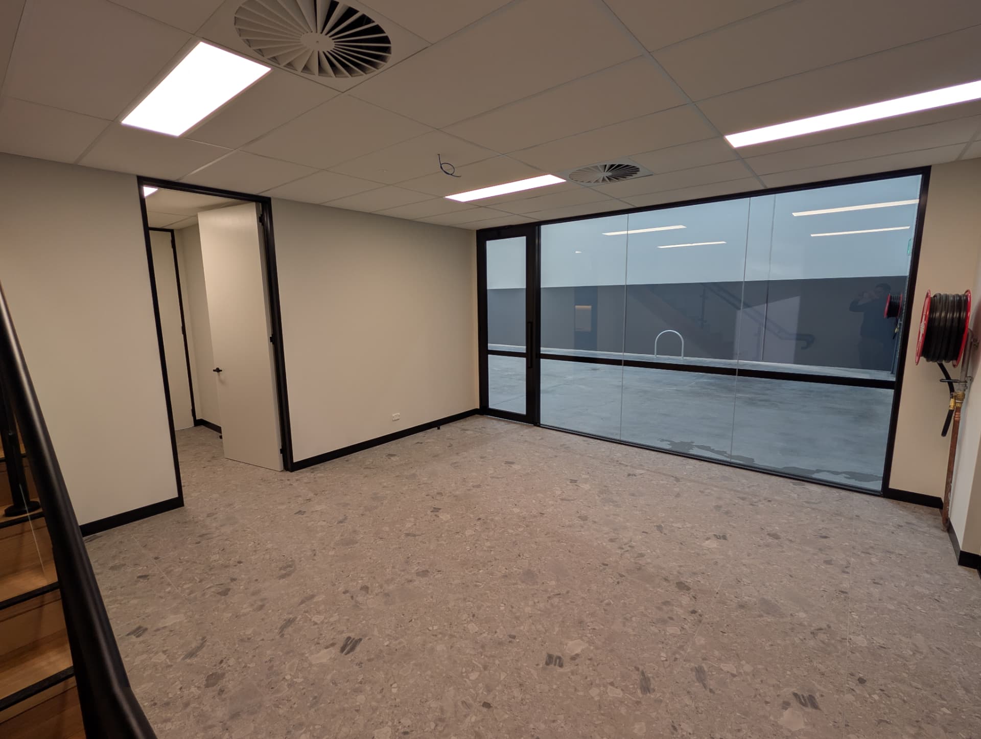 Ground floor office with glazed warehouse outlook